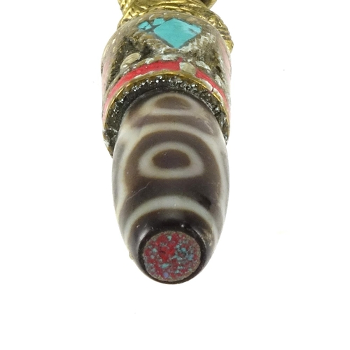 388 - Tibetan brass mounted agate pendant set with turquoise and coral, 9.5cm high