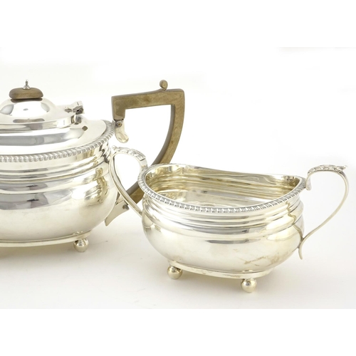 581 - Silver three piece tea service with ball feet, by Goldsmiths & Silversmiths Company, London 1918, th... 