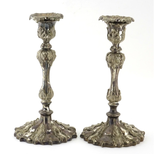 636 - Pair of Elkington & Co silver plated candlesticks, decorated in relief with acanthus leaves, 25.5cm ... 