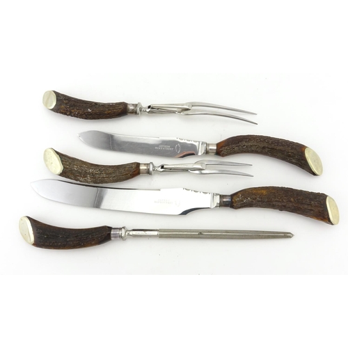 80 - Five piece horn handled carving set, with stainless steel blades, retailed by Asprey Bond Street, ho... 