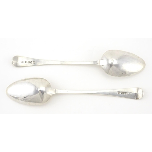 627 - Pair of Georgian silver tablespoons, with engraved decoration, by C Hougham, London 1789, 21.5cm in ... 