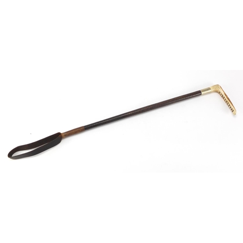 503 - Horn handled riding crop with leather strap, 60cm in length