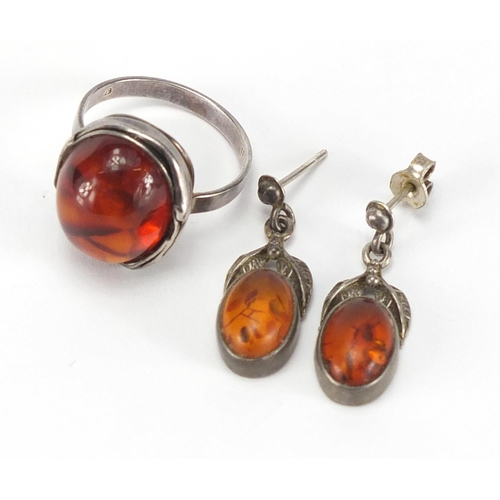 246 - Silver cabochon amber ring and a pair of earrings, the ring size P, approximate weight 8.4g