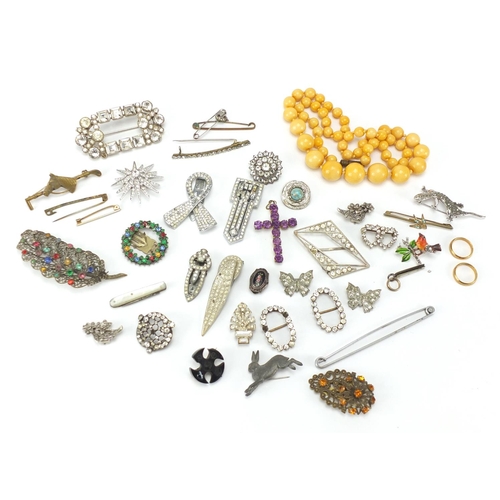 241 - Costume jewellery including Art Deco clips, buckles and amber coloured bead necklace