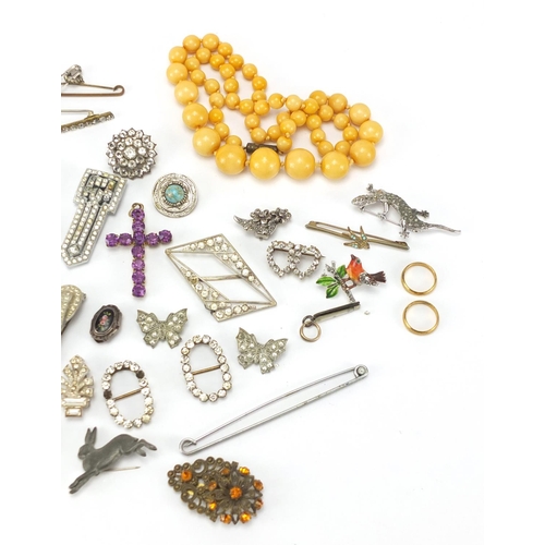 241 - Costume jewellery including Art Deco clips, buckles and amber coloured bead necklace