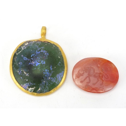 421 - Roman glass pendant and an agate intaglio seal of a lion