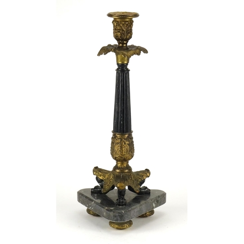 2160 - Ornate gilt candlestick with lion paw feet, raised on a triangular marble base, overall 37.5cm high