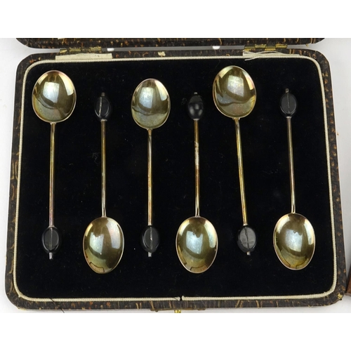 2600 - Two sets of six silver coffee bean spoons, Birmingham hallmarks, each housed in fitted boxes