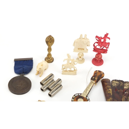 427 - Objects including a miniature tortoiseshell guitar, Chinese carved ivory chess pieces, pipe tamper, ... 