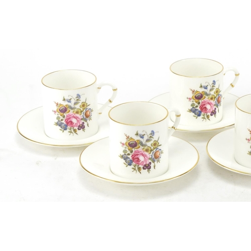 131 - Set of five Royal Worcester coffee cans and six saucers, decorated with flowers