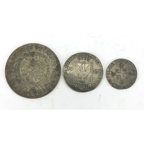 693 - Three antique silver coloured metal coins, the largest 3.5cm in diameter