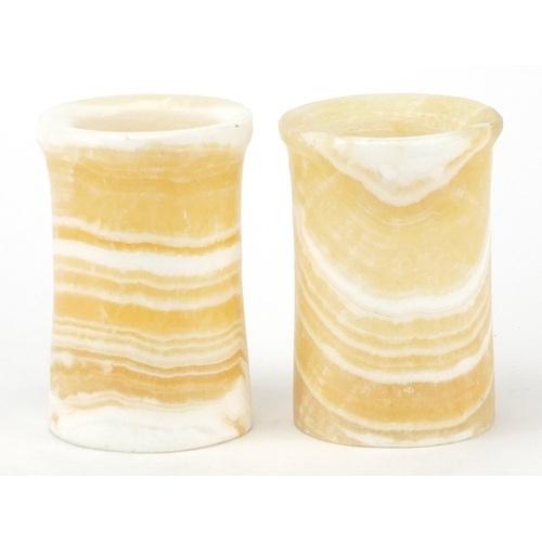 588 - Two Egyptian alabaster cylindrical pots, 12cm high