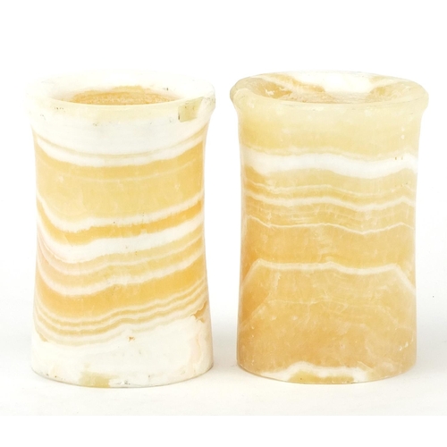 588 - Two Egyptian alabaster cylindrical pots, 12cm high