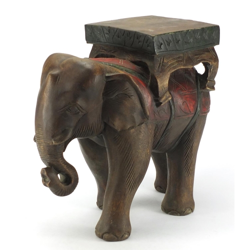 630 - African carved wood elephant plant stand, 40cm high
