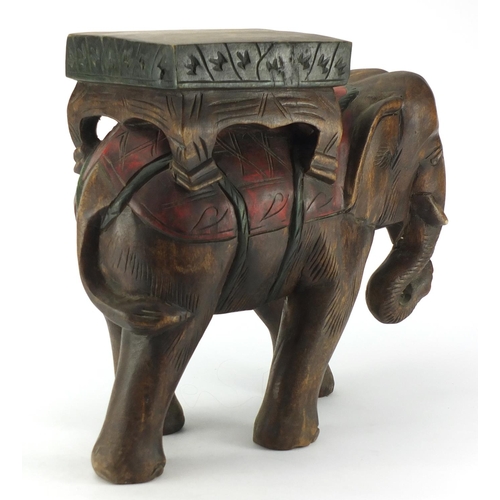 630 - African carved wood elephant plant stand, 40cm high
