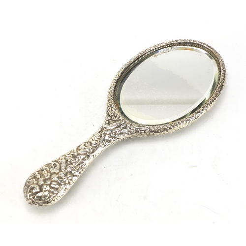 318 - Silver backed dressing table mirror, Birmingham hallmarked, 27cm in length
