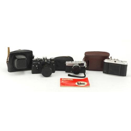 136 - Three vintage cameras including Zenit EM & Agfa Isolette