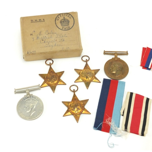 729 - Five British Military World War II medals, with ribbons and a box of issue for E.Coles