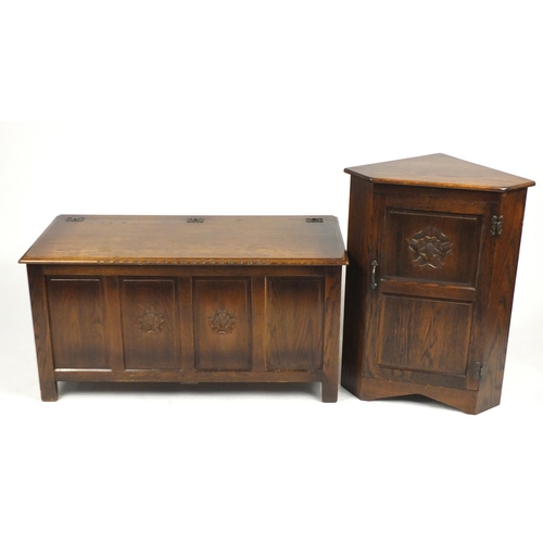 8 - Oak blanket box and corner cupboard carved with a Tudor rose, the corner cupboard with Webber Furnit... 