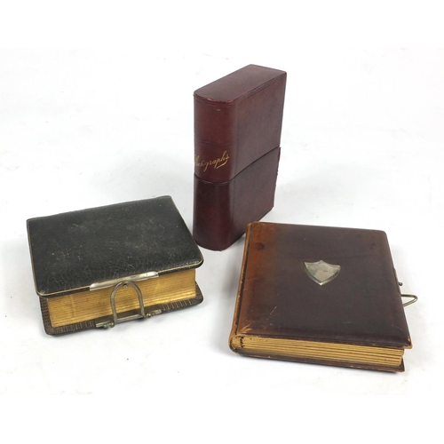 674 - Three Victorian leather cabinet card and photograph albums, with some photographs