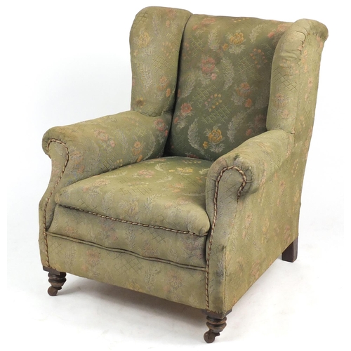7 - Wingback armchair with green floral horse hair upholstery