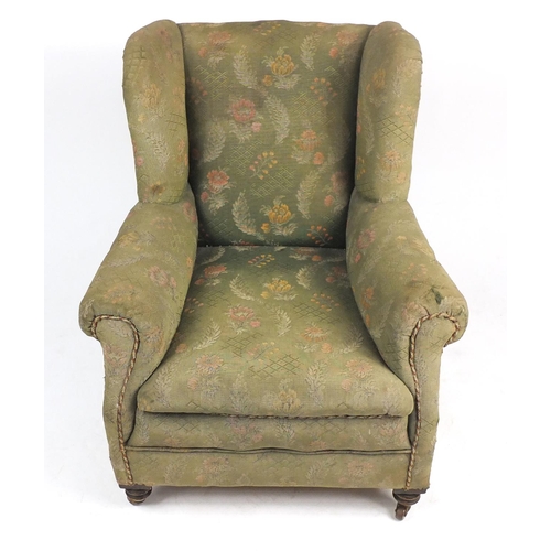 7 - Wingback armchair with green floral horse hair upholstery