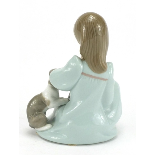 80 - Lladro figure of a young girl seated with a puppy and kitten, 14.5cm high