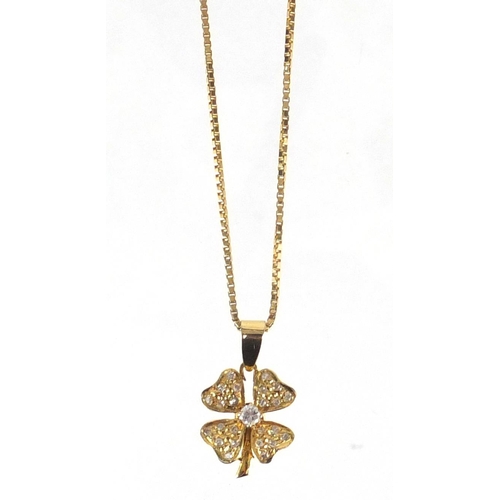 660 - Unmarked gold diamond four leaf clover pedant on an 18ct gold necklace, the pendant 2.5cm in length,... 