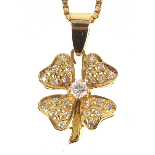 660 - Unmarked gold diamond four leaf clover pedant on an 18ct gold necklace, the pendant 2.5cm in length,... 