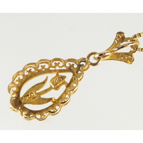 724 - 17ct gold flower pendant on an unmarked gold necklace, the pendant 3.2cm in length, approximate weig... 
