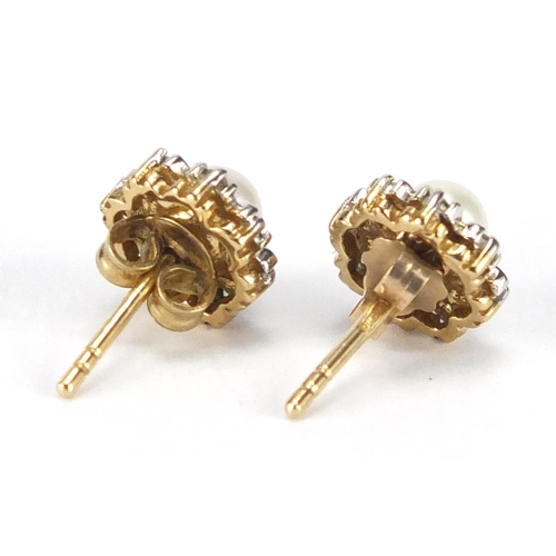 709 - Pair of unmarked gold pearl and diamond flower head earrings, 7mm in diameter, approximate weight 1.... 
