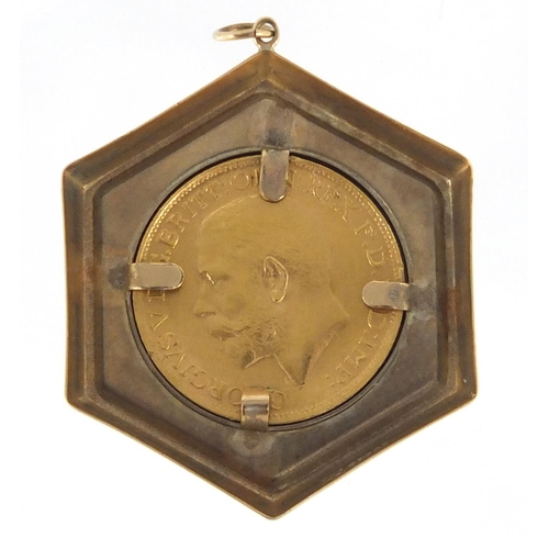 673 - George V 1919 gold sovereign set in a 9ct gold pendant mount, approximate weight 11.6g