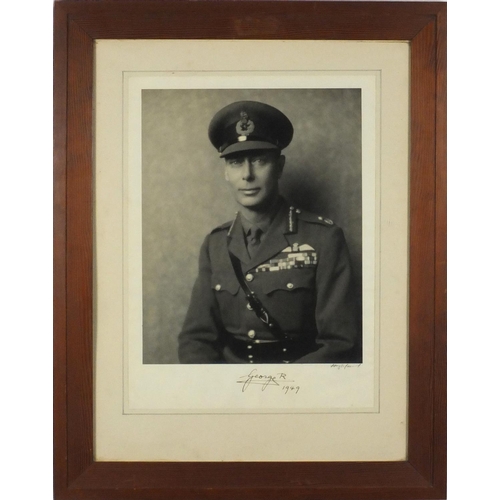 120 - Black and white photograph of King George VI in Military uniform by Hugh Cecil, signed by King Georg... 