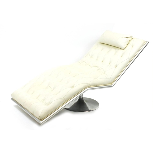 11 - Contemporary cream leather day bed with chrome swivel base, approximately 170cm in length
