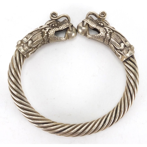 477 - Chinese silver coloured metal dragon bangle, 9cm in diameter