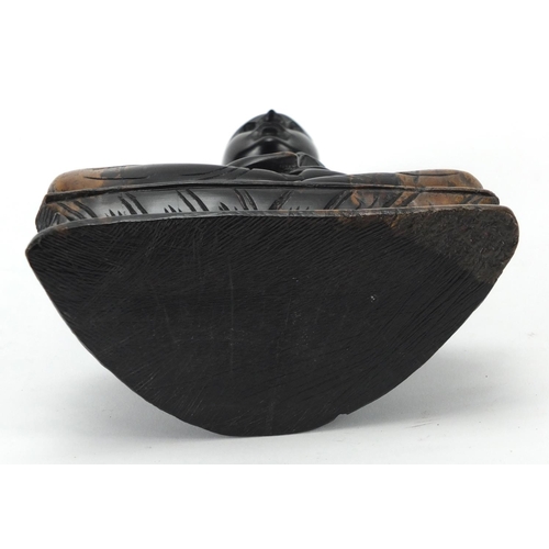 595 - Chinese ebonised carved wood figure of a seated Buddha, 24cm high