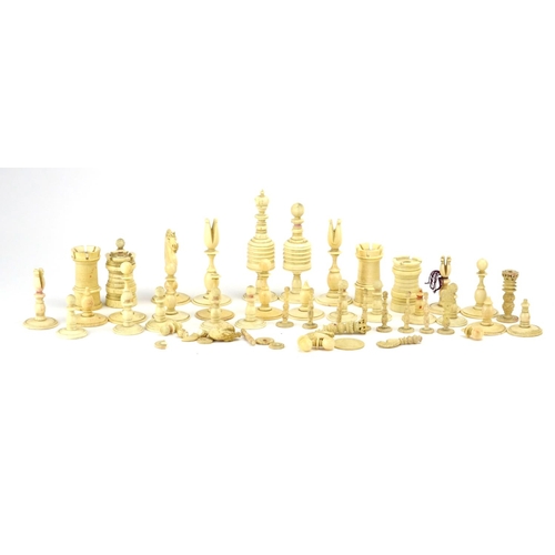 257 - 19th century and later part stained carved ivory and bone chess pieces, the largest 10cm high
