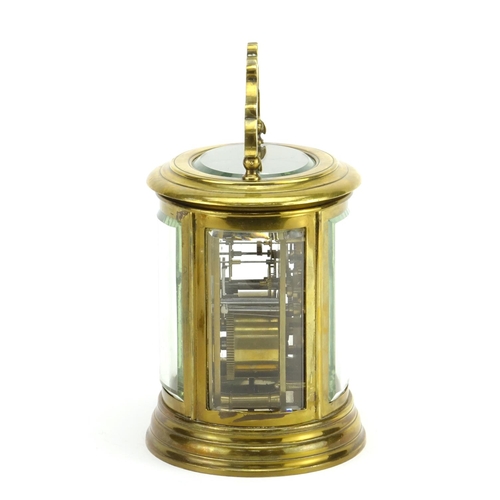 815 - 19th century oval brass cased carriage clock striking on a gong, with bevelled glass, enamelled dial... 