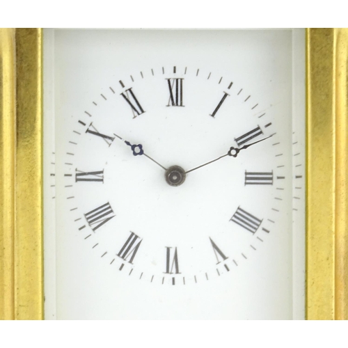 818 - Miniature gilt brass carriage clock, with enamelled dial and Roman numerals, 7.5cm high