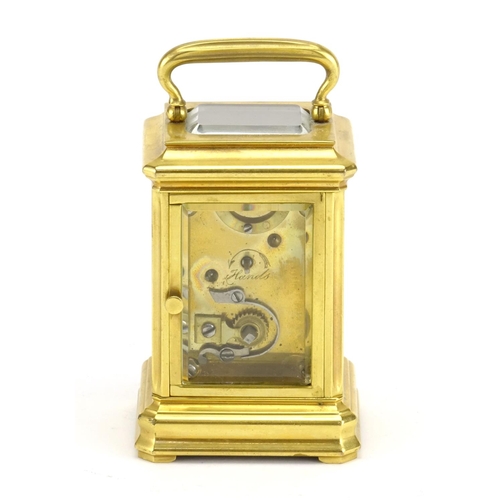 818 - Miniature gilt brass carriage clock, with enamelled dial and Roman numerals, 7.5cm high