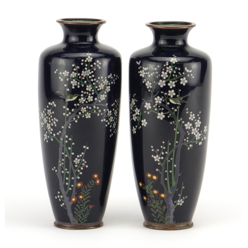 321 - Pair of Japanese cloisonné vases enamelled with birds amongst trees and flowers, each 18cm high