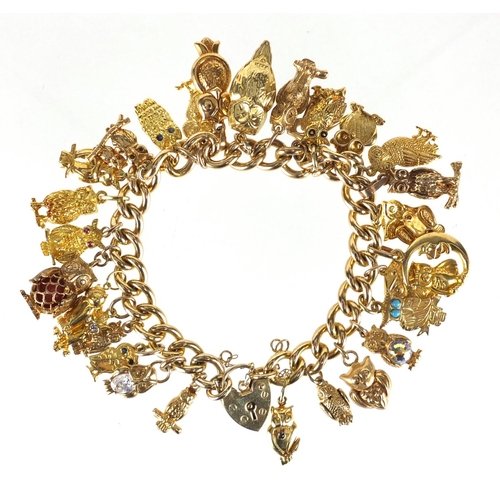 637 - Good 9ct gold charm bracelet with a large selection of mostly gold owl charms including 18ct, 14ct a... 