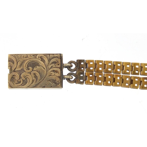 643 - Antique French unmarked gold and enamel bracelet, housed in a fitted tooled leather box, 18cm in len... 