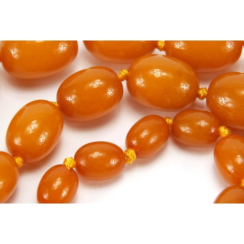 763 - Amber coloured bead necklace, 64cm in length, approximate weight 32.0g