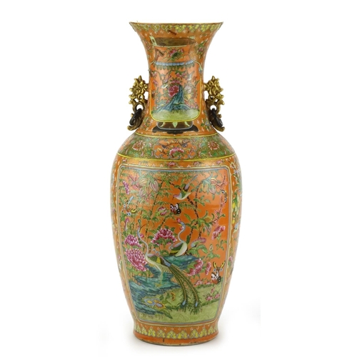 295 - Large Chinese orange ground porcelain vase with twin handles, finely hand painted in the famille ros... 
