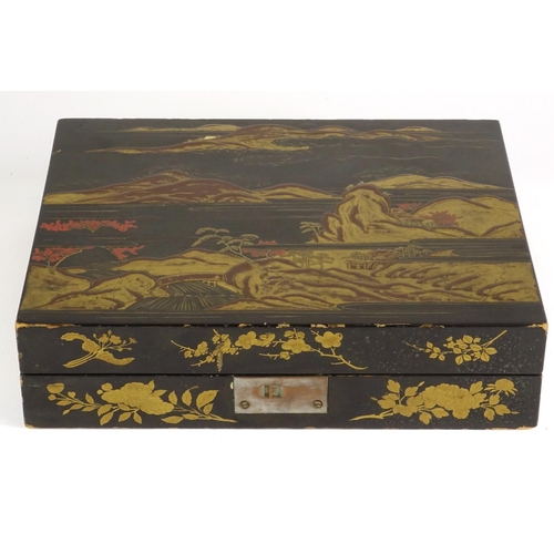 363 - Chinese black lacquer box, the hinged lid gilded with a landscape opening to reveal six boxes gilded... 