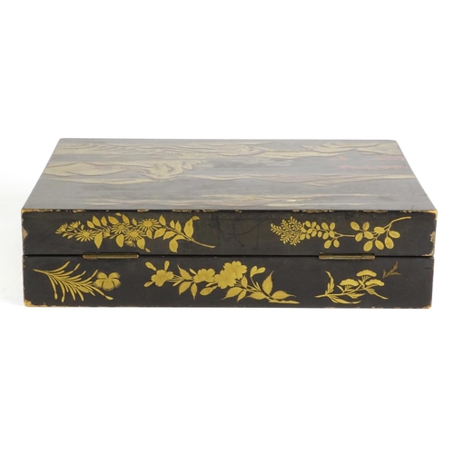 363 - Chinese black lacquer box, the hinged lid gilded with a landscape opening to reveal six boxes gilded... 