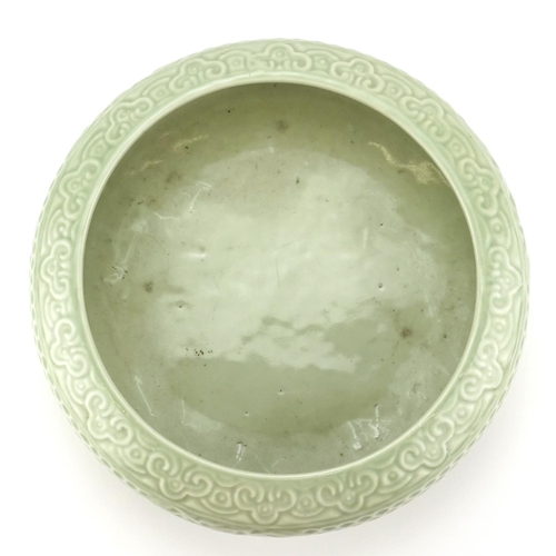 306 - Chinese celadon glazed squatted bowl, raised on a carved wood stand, six figure character marks to t... 