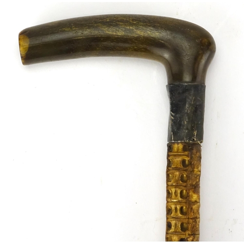 115 - Horn handled vertebrae walking stick, with silver collar, 85cm in length