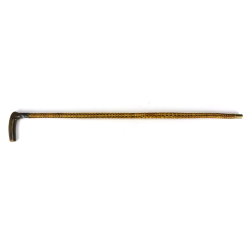 115 - Horn handled vertebrae walking stick, with silver collar, 85cm in length